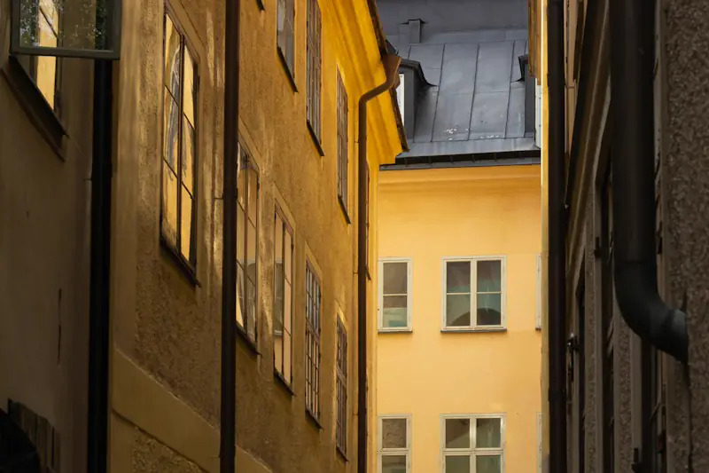 A lamp lit in a narrow alley in Stockholm’s old town