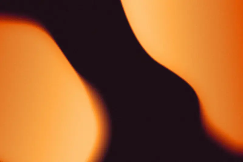 Soft orange light against a dark background